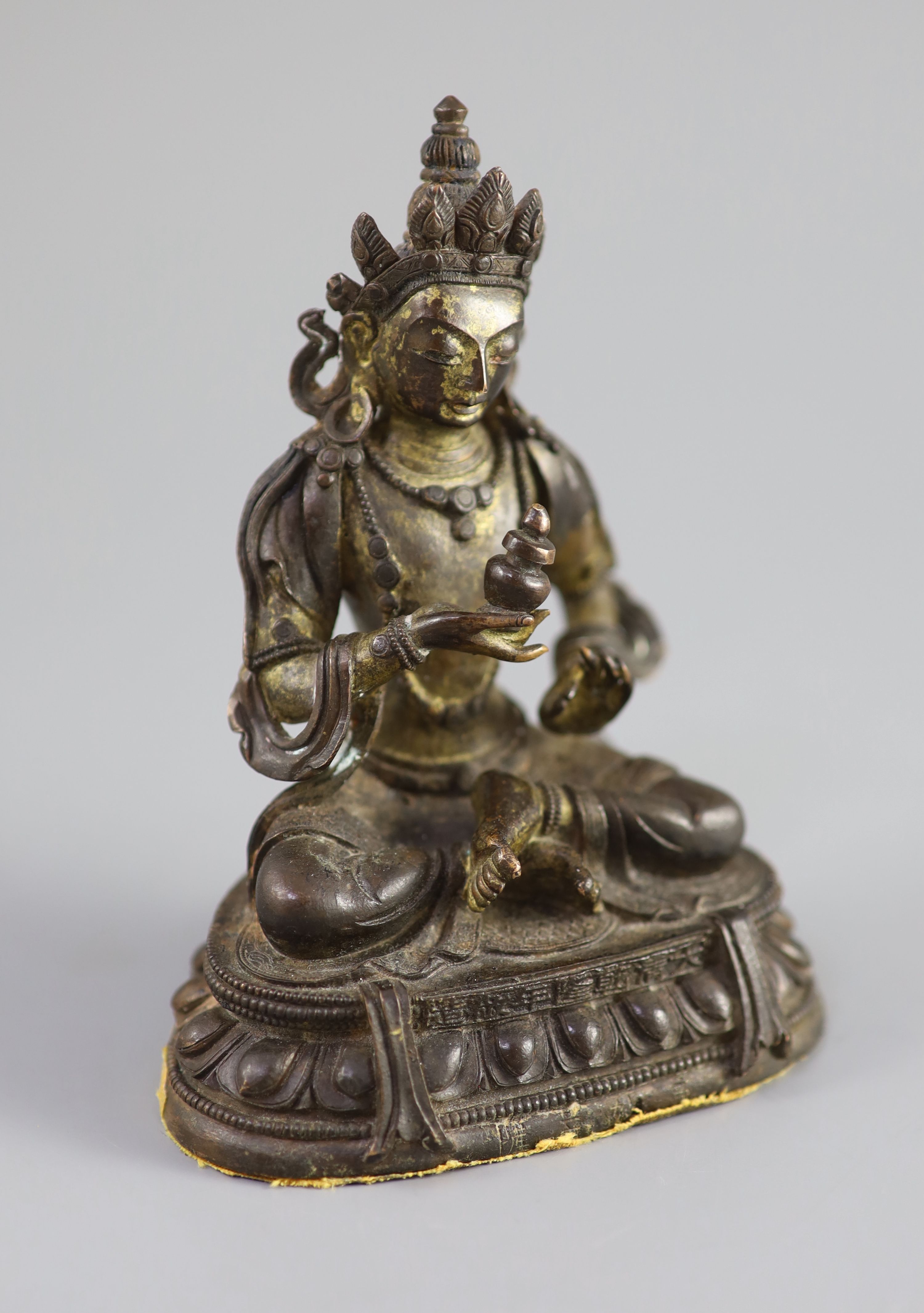 A Chinese gilt bronze figure of Amitayus, Qianlong mark and period (1736-95), 12.5 cm high
